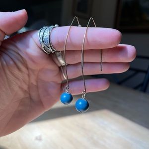 gold earrings with blue bead